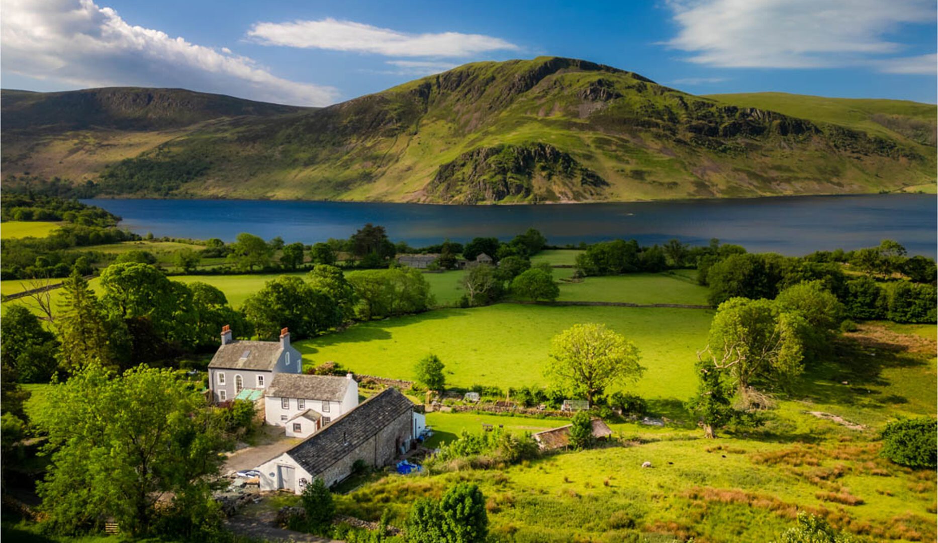 Wild Wool Barn in Ennerdale view of farm showwing ennerdale water and mountains behind