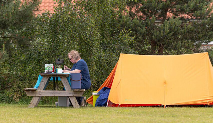 small tent and picnic table at the campsite at deepdale on the North Norfolk Coast