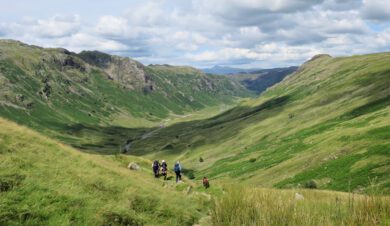 walkers on the lakeland way route through the Langstrath Valley