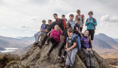 scout group on top of a hill in snowdonia