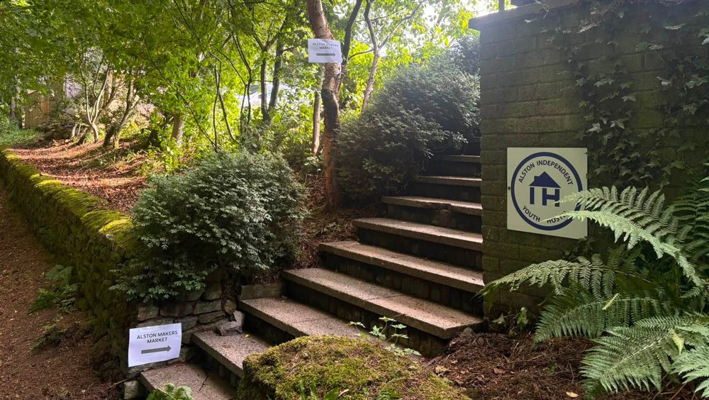 signs for community makers market at alston youth hostel