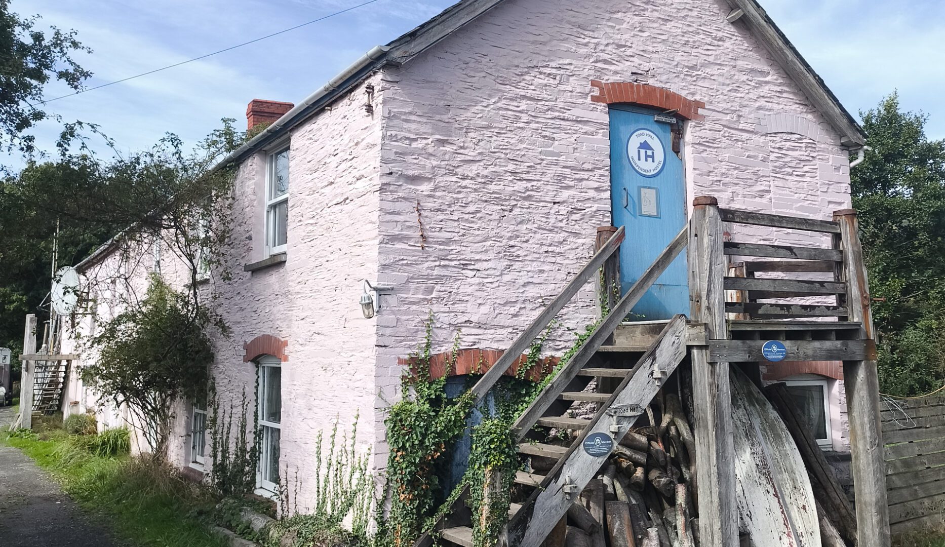 Outside of toad hall hostel accommodation showing the independent hostels sign