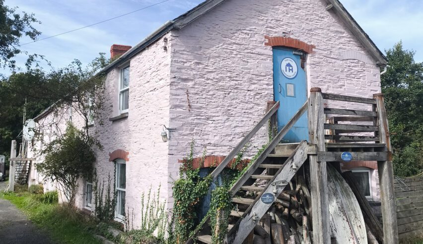 Outside of toad hall hostel accommodation showing the independent hostels sign