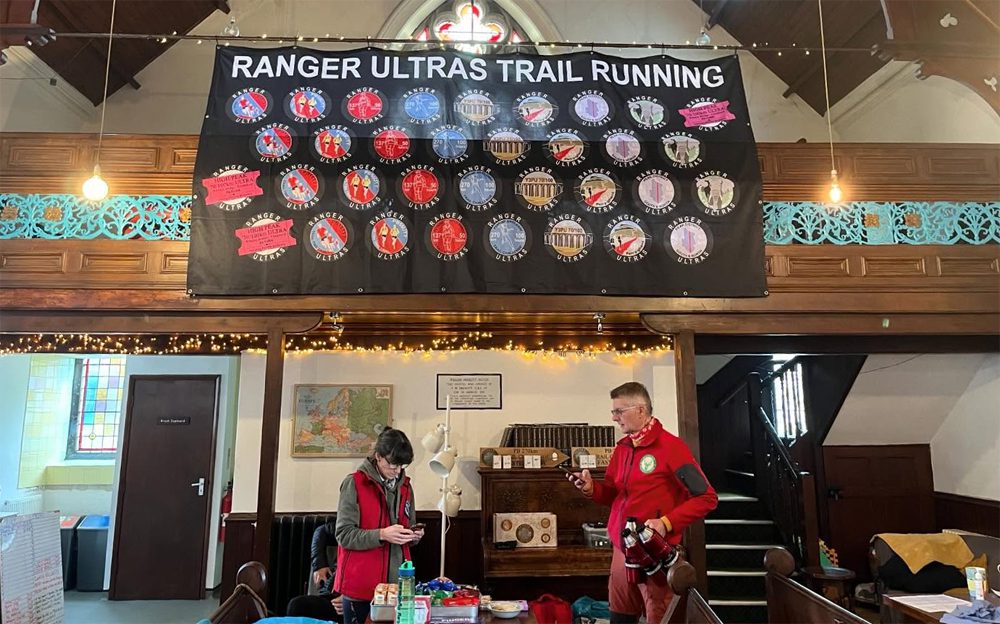 2 people organising a challenge at kirkby stephen hostel