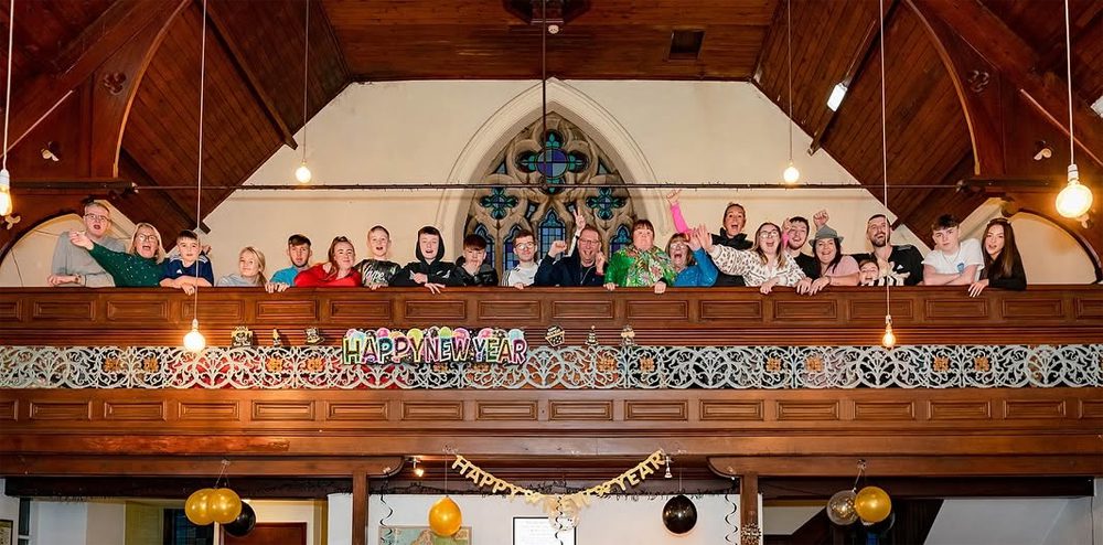 crowd of young people on the gallery balcony at kirkby stephen hostel