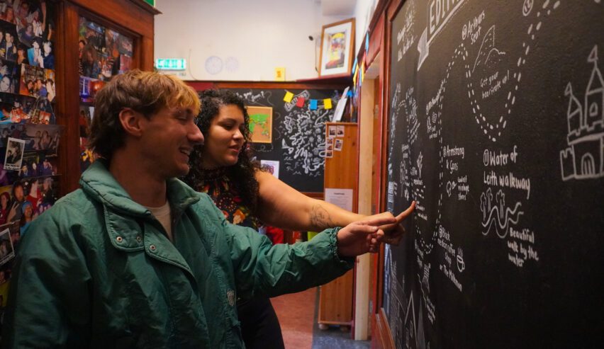 activity board at Reception at Royal Mile Backpackers