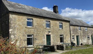 exterior view of Willow Bog Cottage with blue sky